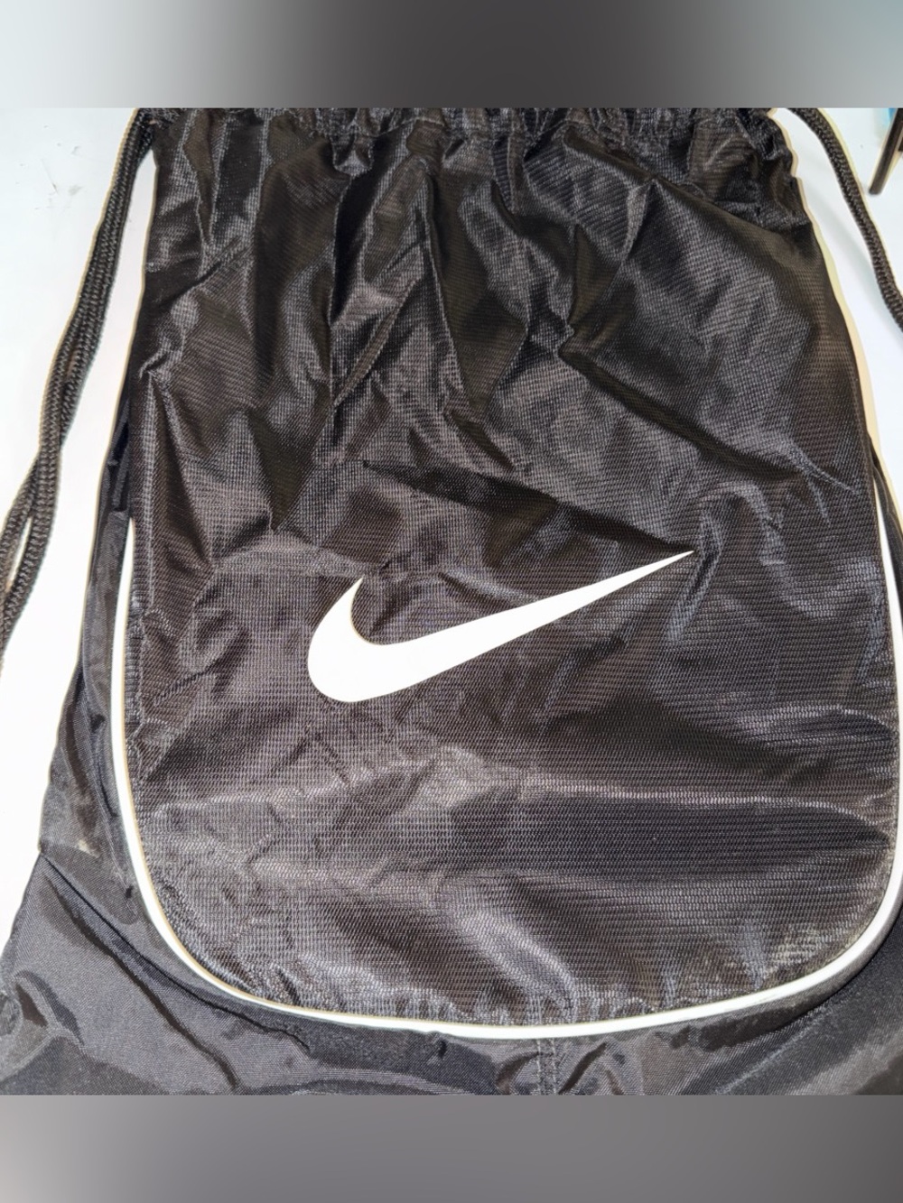Nike Black Drawstring Backpack with White Swoosh